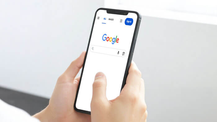 female talking into mobile device