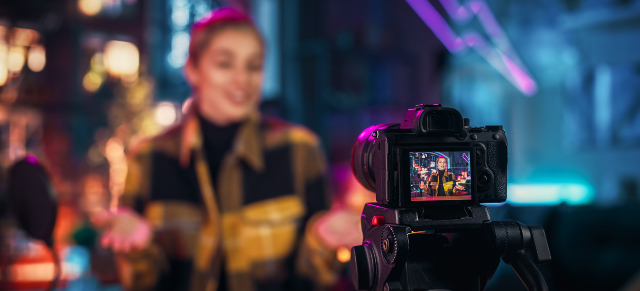 female being recorded on video for live stream