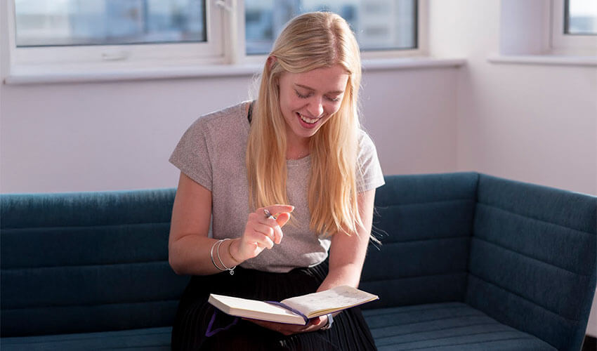 Ettie using a notebook.