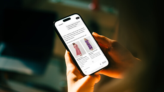 a woman using ChatGPT on her phone featuring fashion ads