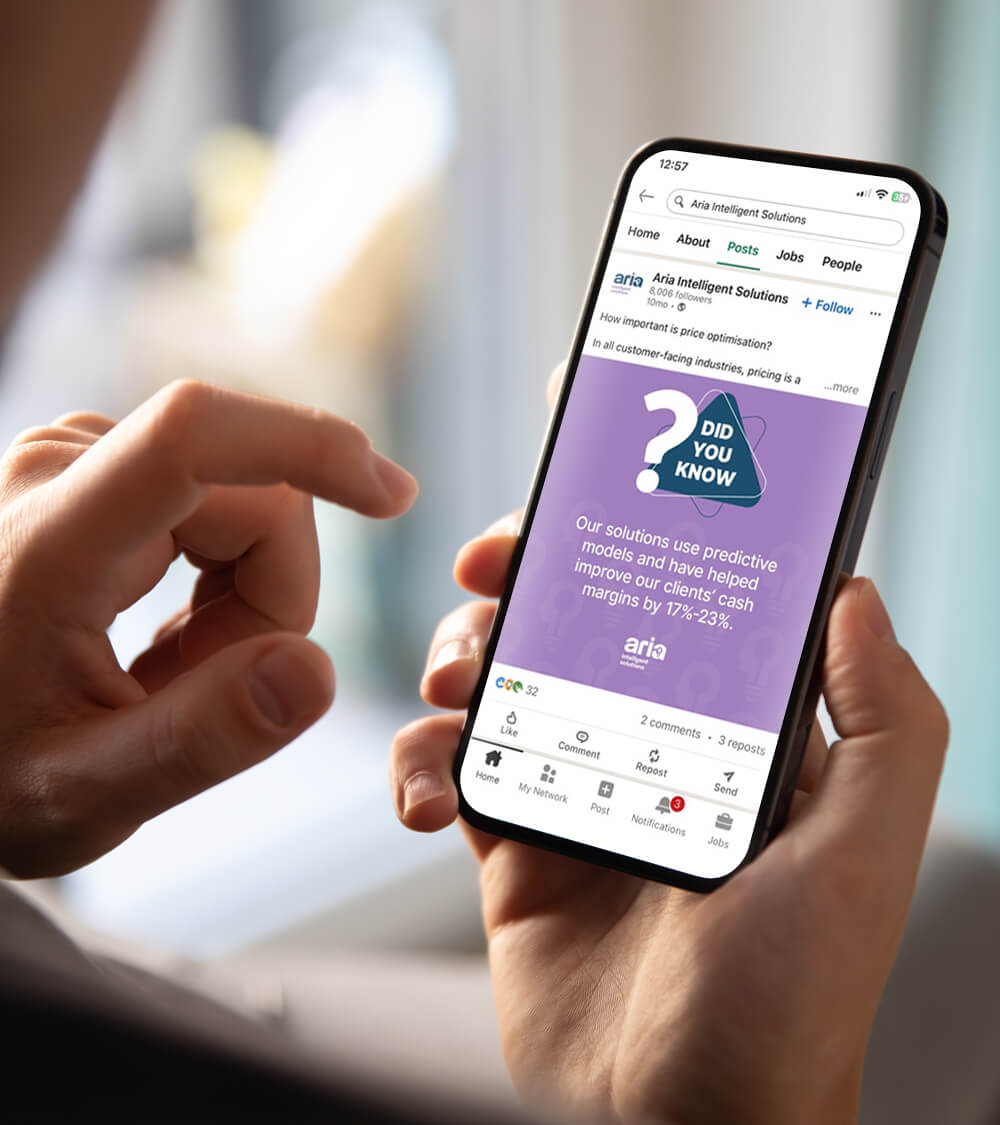 a person using LinkedIn on their mobile viewing an Aria Intelligent Solutions post