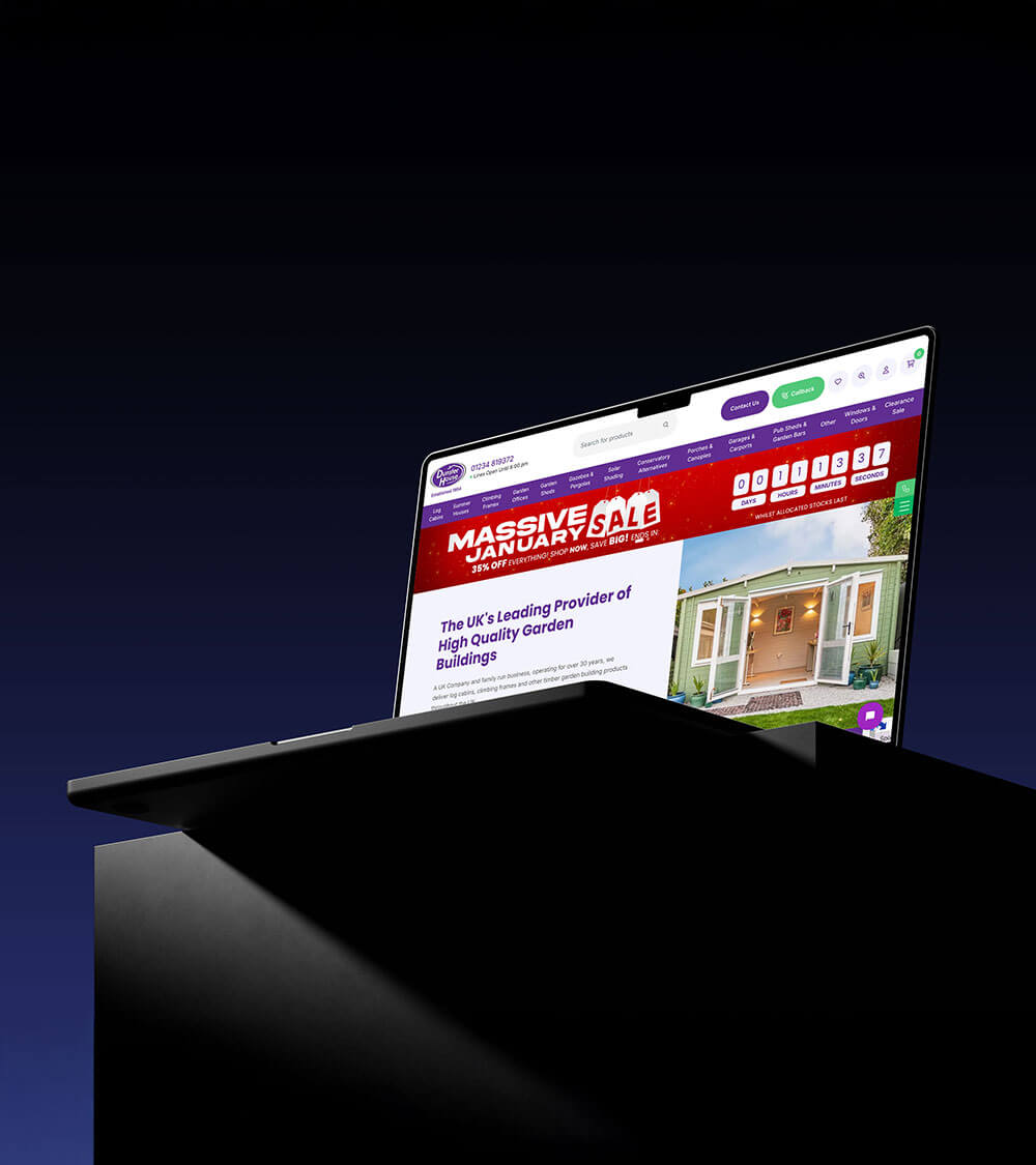 a laptop featuring the Dunster House website on the screen