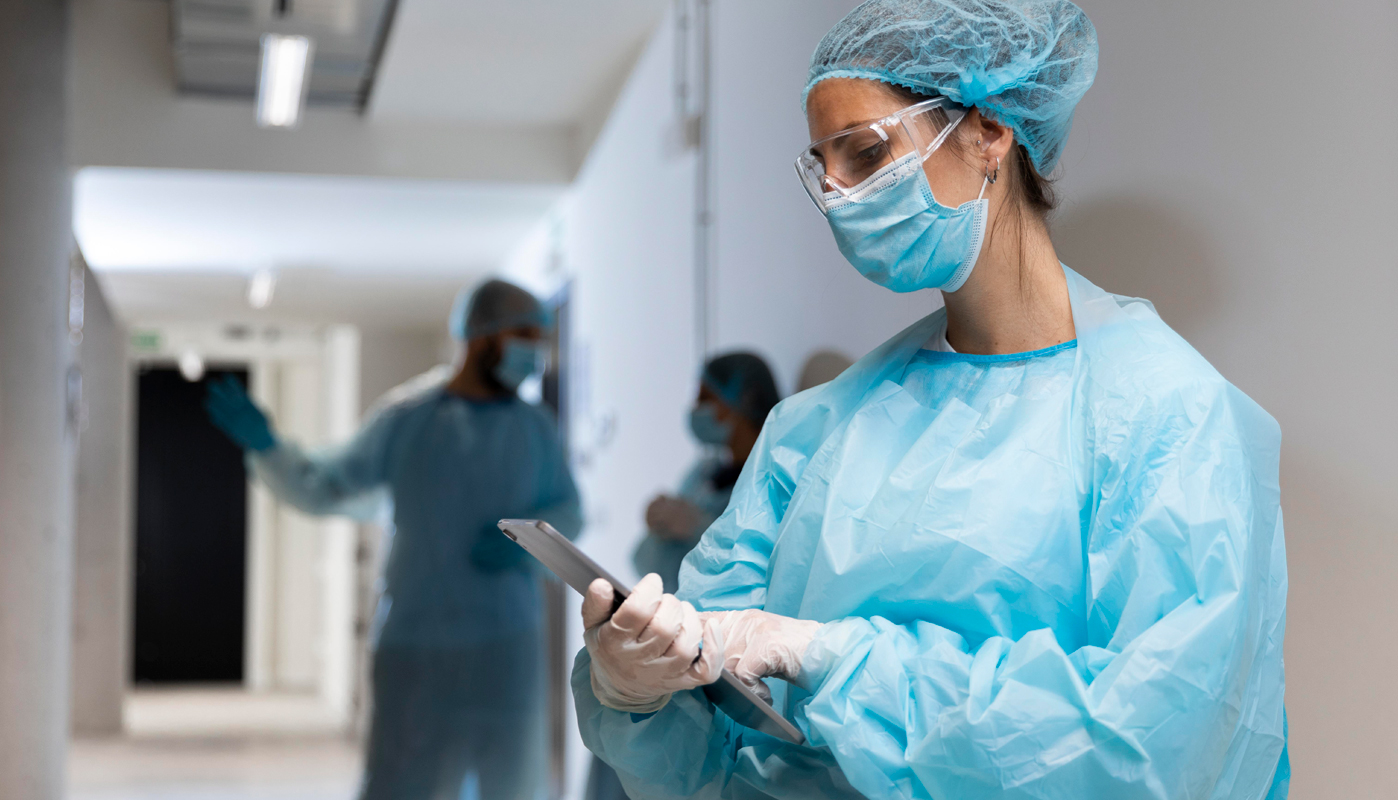 Medical workers on tablet device