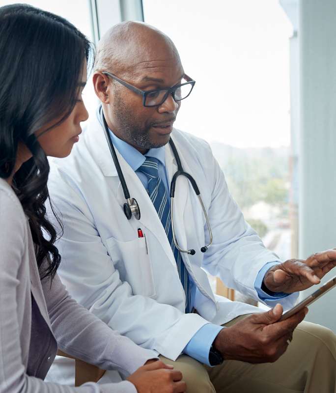 2 doctors on a tablet device
