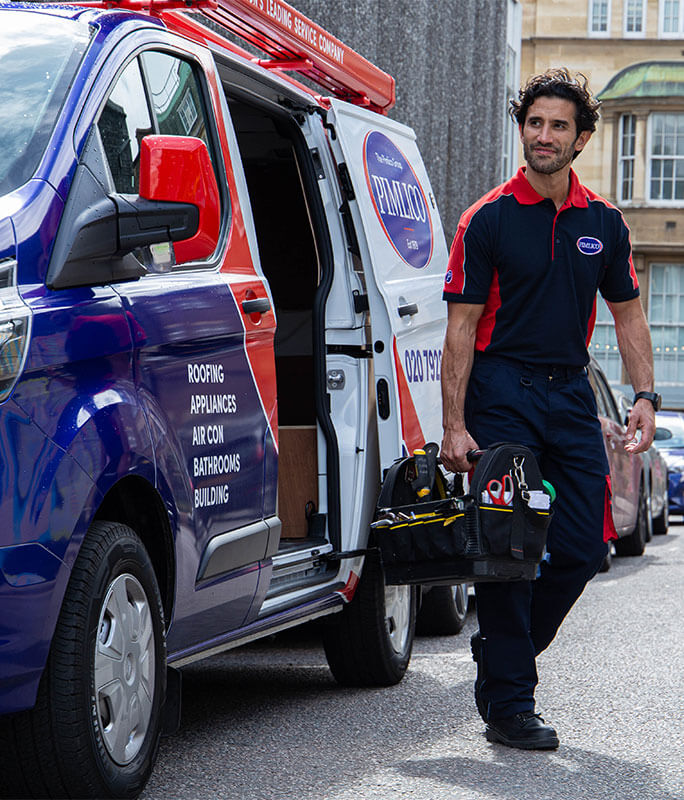 an electrician stepping out of a Pimlico Plumbers van with a toolbox