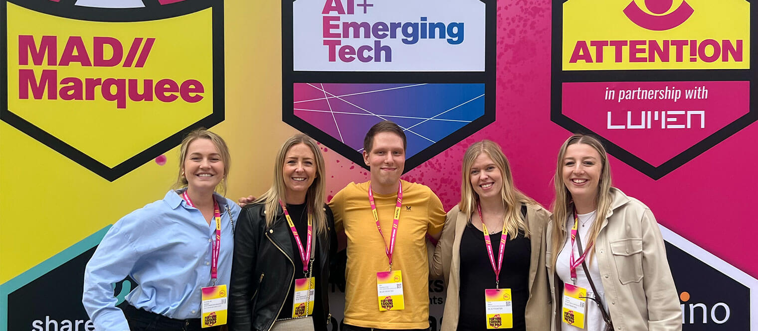 The team posing for a photo together at MAD//Fest 2024.