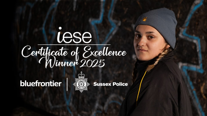 Girl from Sussex Police campaign alongside the iese logo and Certificate of Excellence Winner 2025 text.