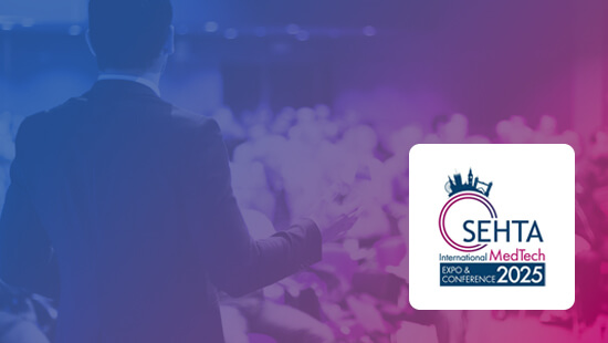 a spokesperson speaking at a conference with a blue and pink gradient featuring the SEHTA International MedTech Expo & Conference logo