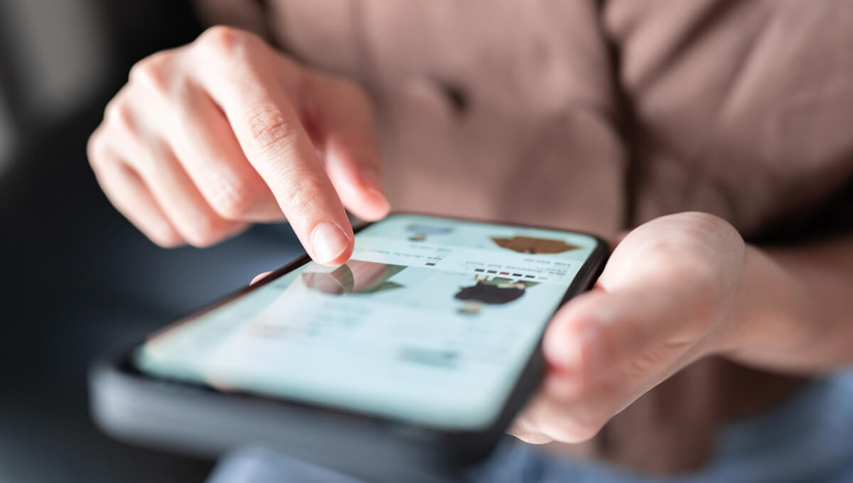 a man using an online retailer's website on his phone