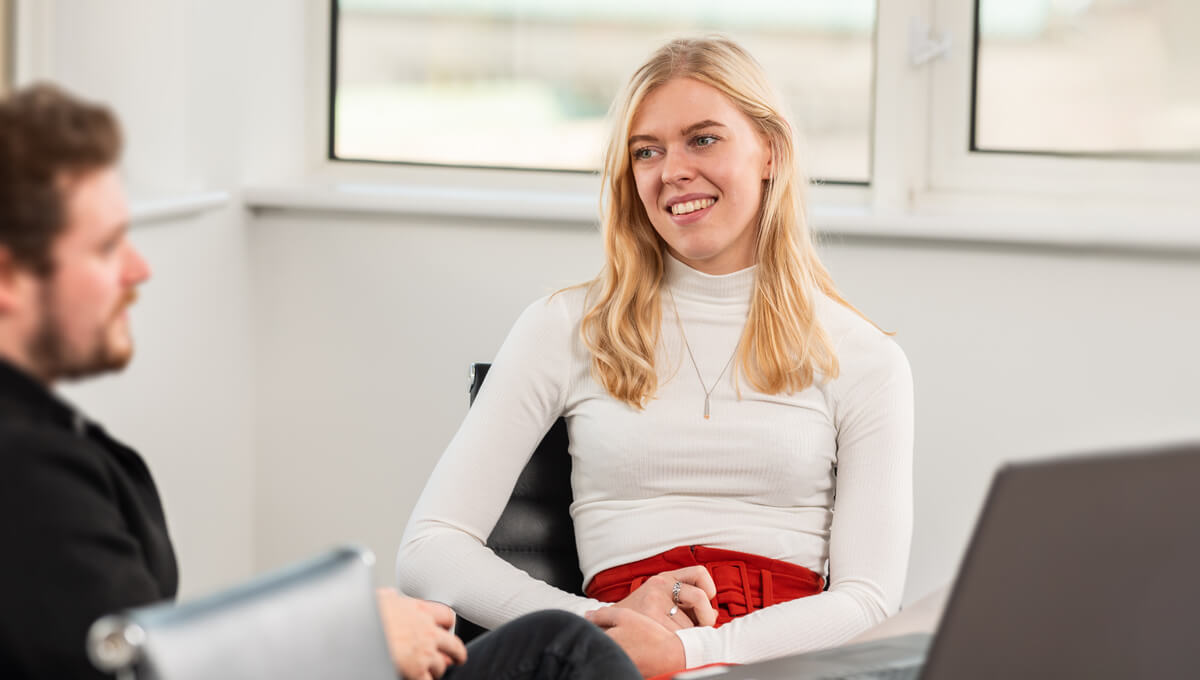 Ettie Hilton, Paid Advertising Manager speaking with a client