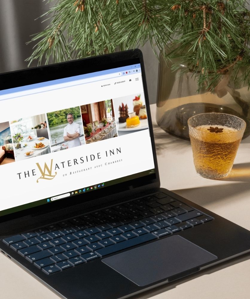 a laptop screen displaying a high-end restaurant website