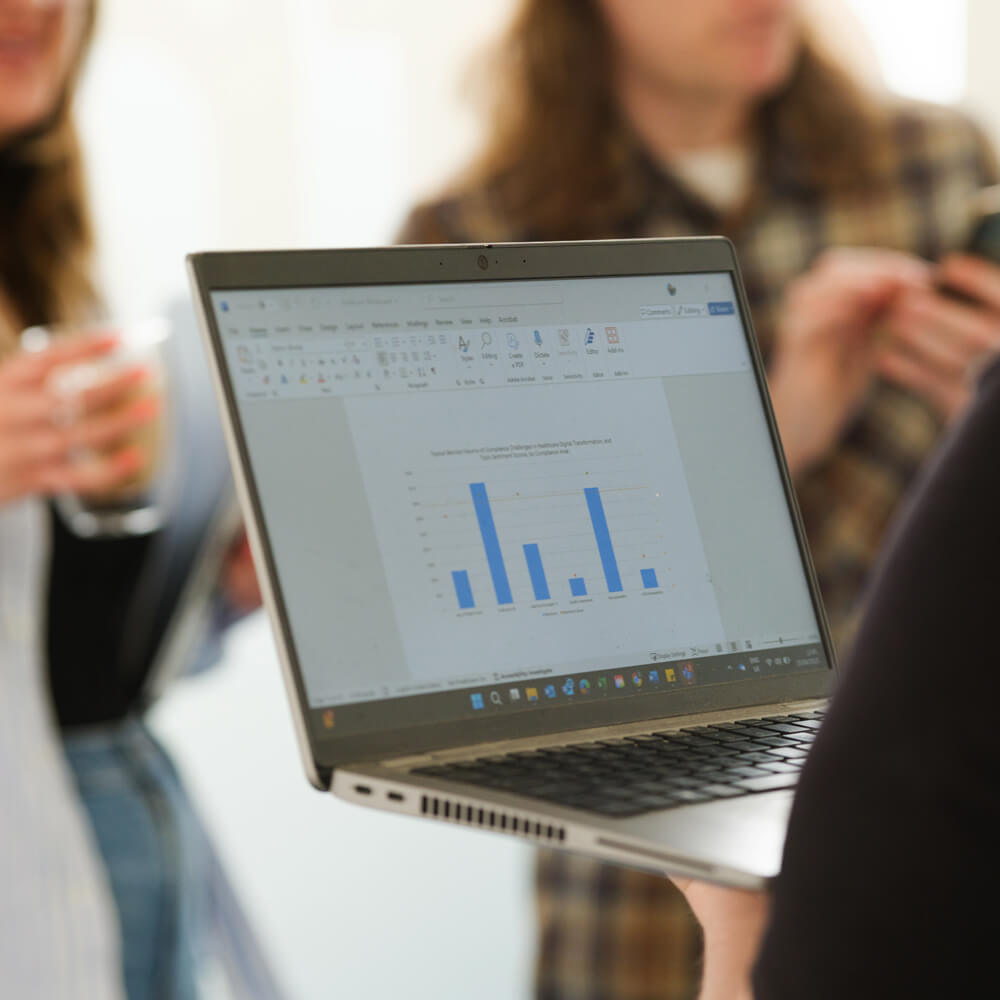 a laptop with a data graph on screen