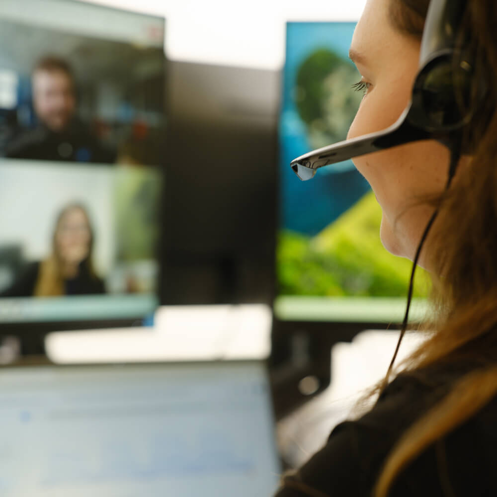 a person wearing a headset participating in an online video call
