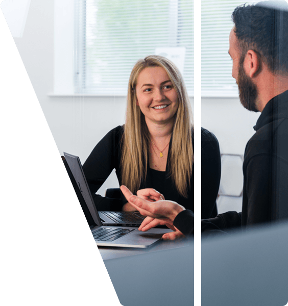 a client meeting a project manager to discuss development progress in a bright meeting room