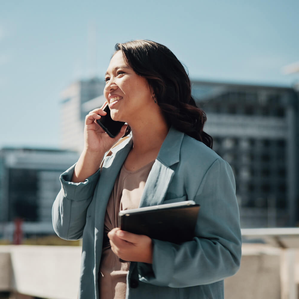 a property agent on the phone to a client