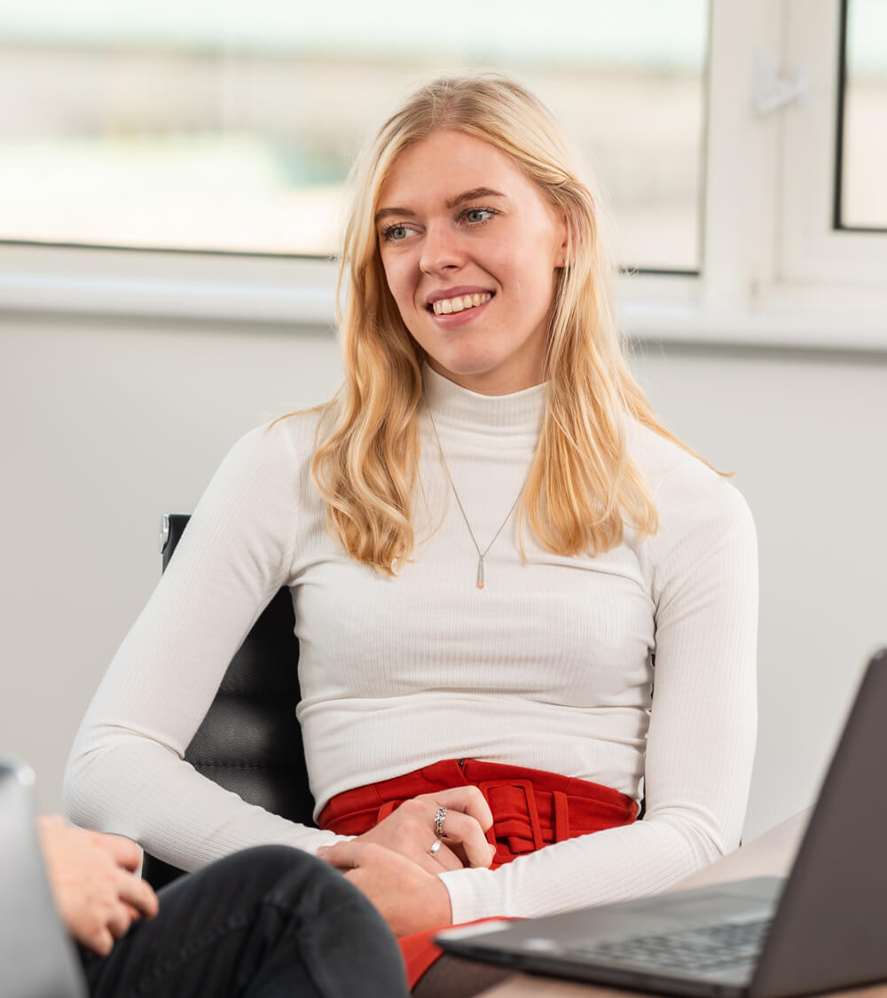 a digital marketer in a meeting with a client