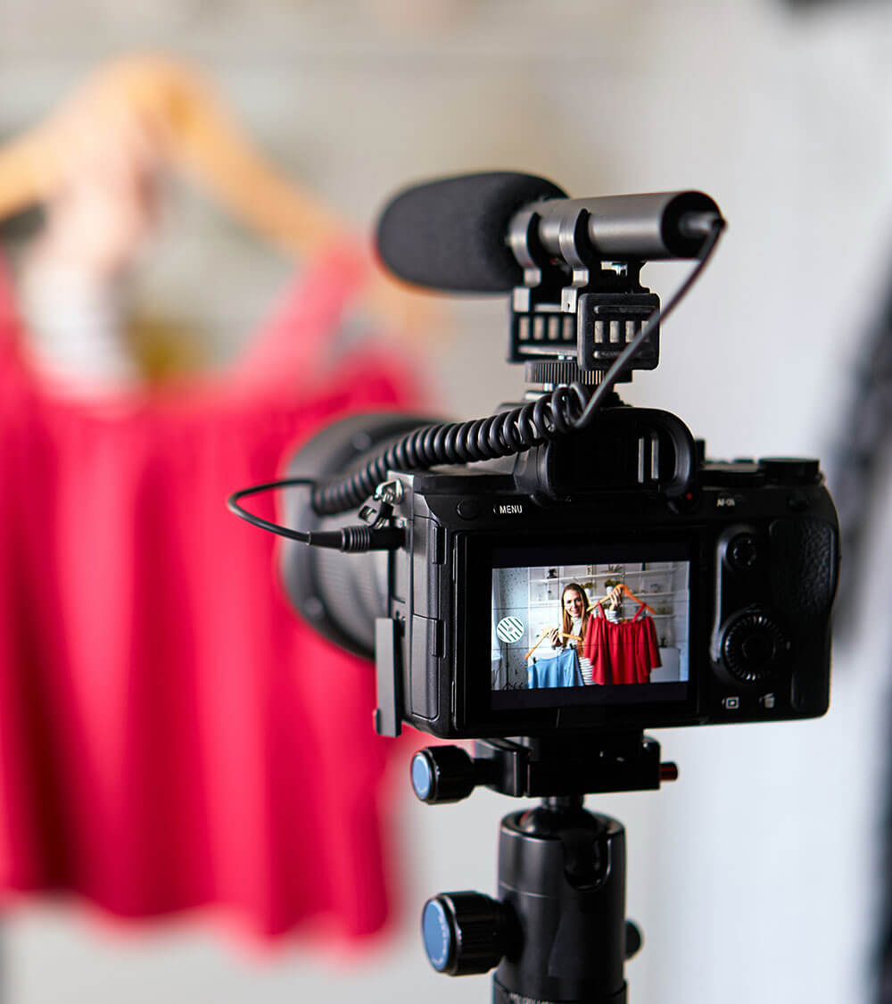 Camera recording woman with clothes