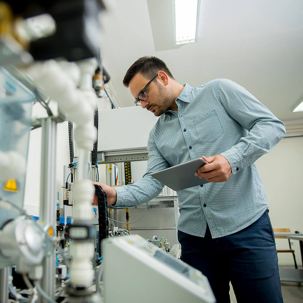 Man holding device in medical lab Man holding device in medical lab