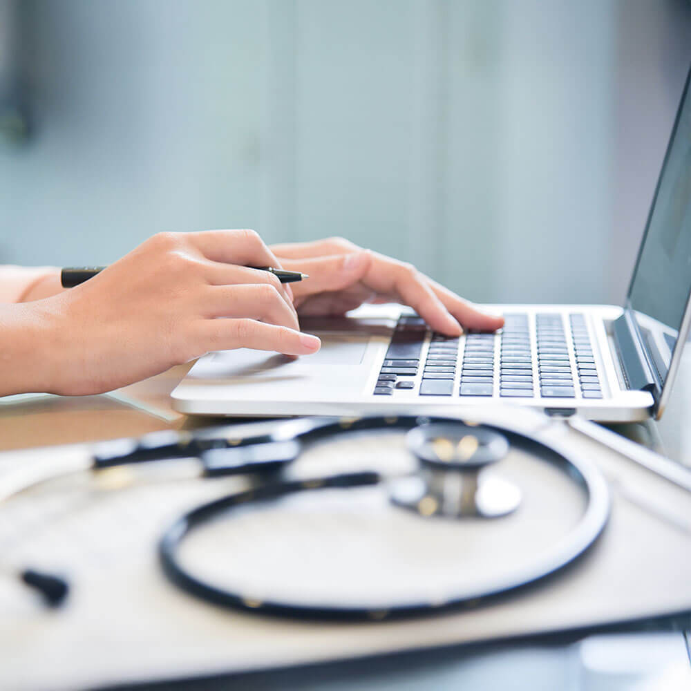 Medical Software Development - Working on laptop Medical Software Development - Working on laptop