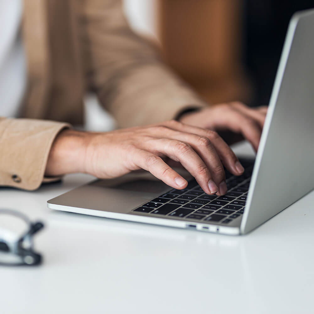 Person typing on laptop computer
