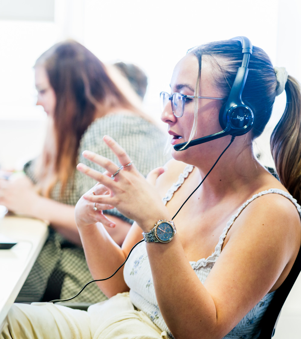 Olivia answering the phone in the Southampton office